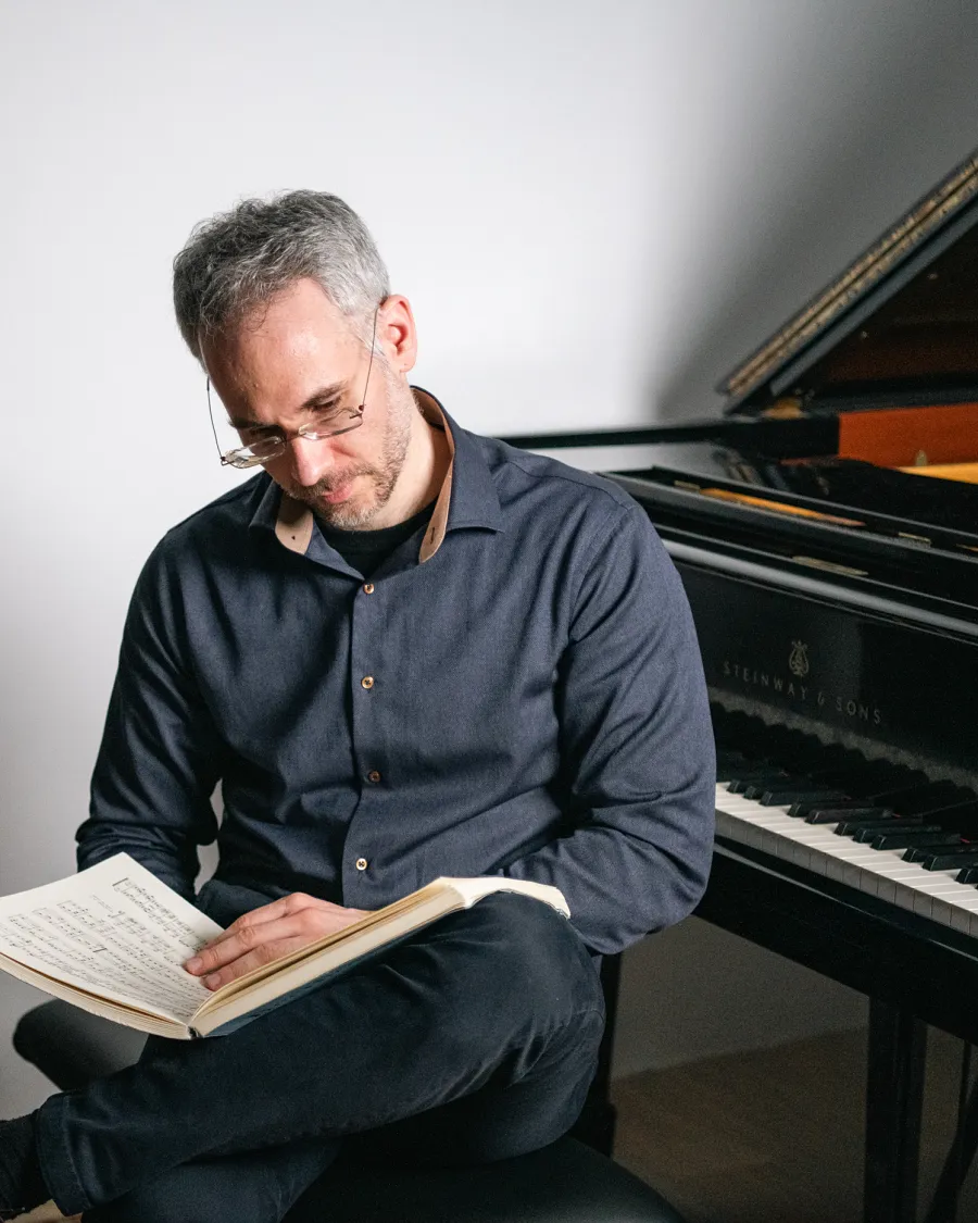 Dimitris Petrovas studying a Beethoven score at the piano
